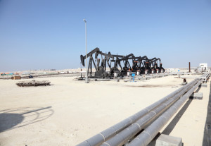 Oil pump jacks in the desert of the Middle East. Source: www.dreamstime.com © Typhoonski